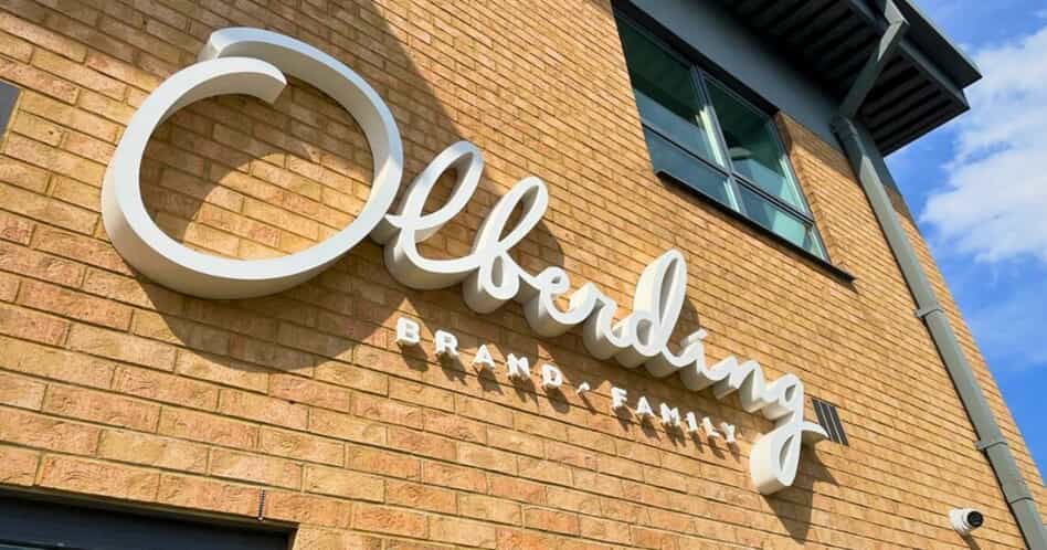 Close-up of built-up aluminium and acrylic lettering installed on a brick building facade for Olberding Brand Family at Estuary Business Park, Hull.
